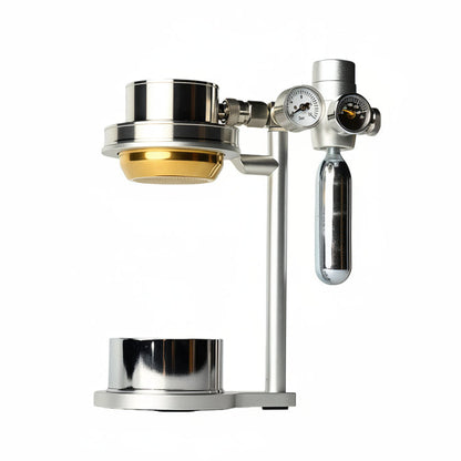 Metal coffee brewing device with gold component on a white background