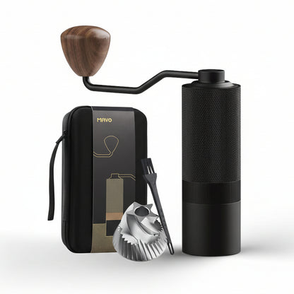 Black coffee grinder with wooden handle, carrying case, and additional tools on a white background